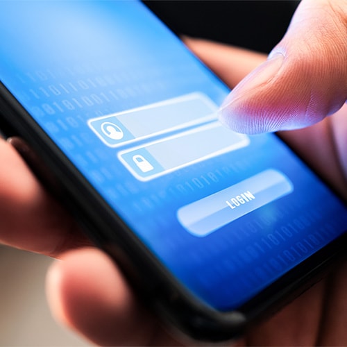 An image of a cybercriminal trying to gain access to a phone using credential stuffing.